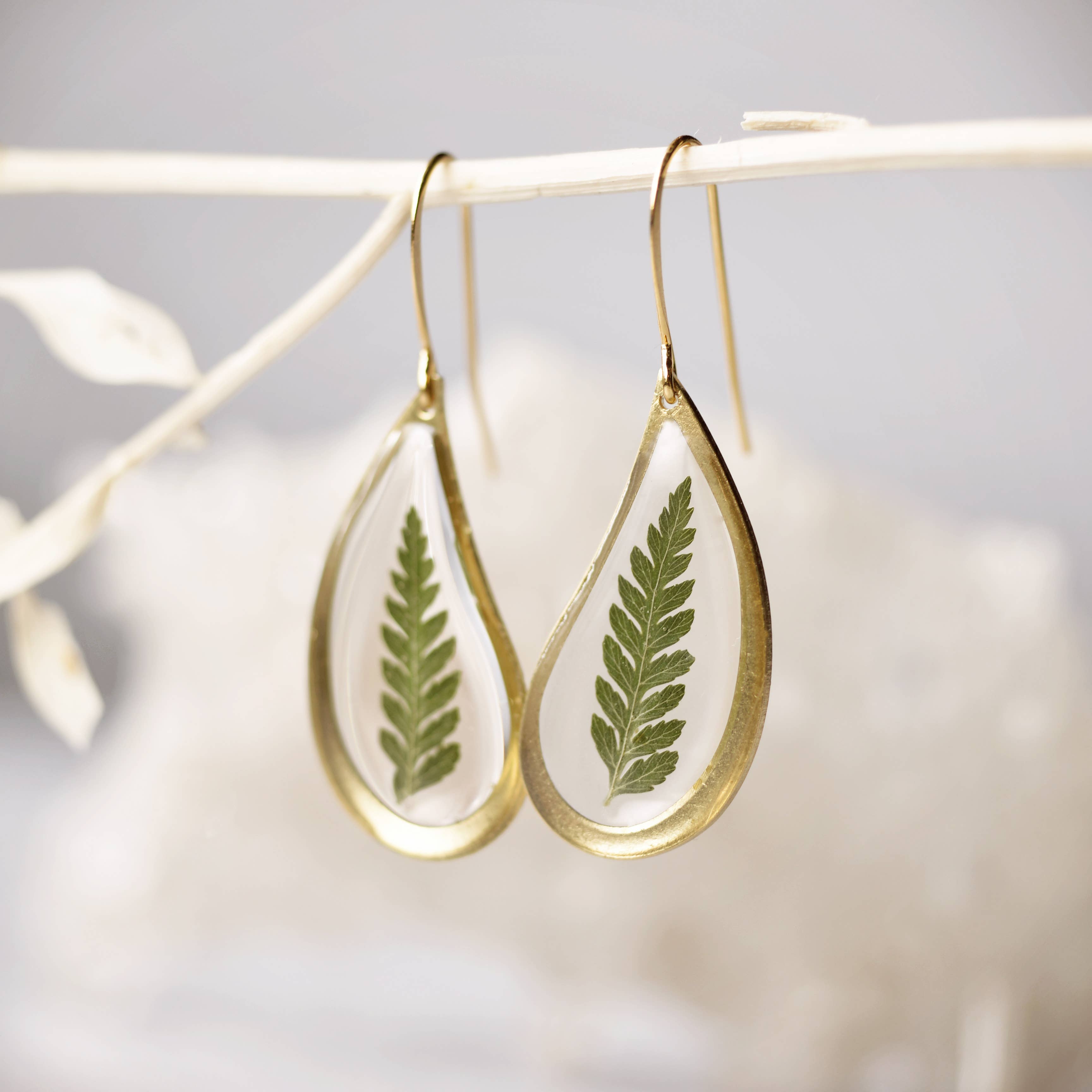 Handmade, hand pressed fern teardrop earrings from a real fern made in resin. Gold plated earring hooks. 