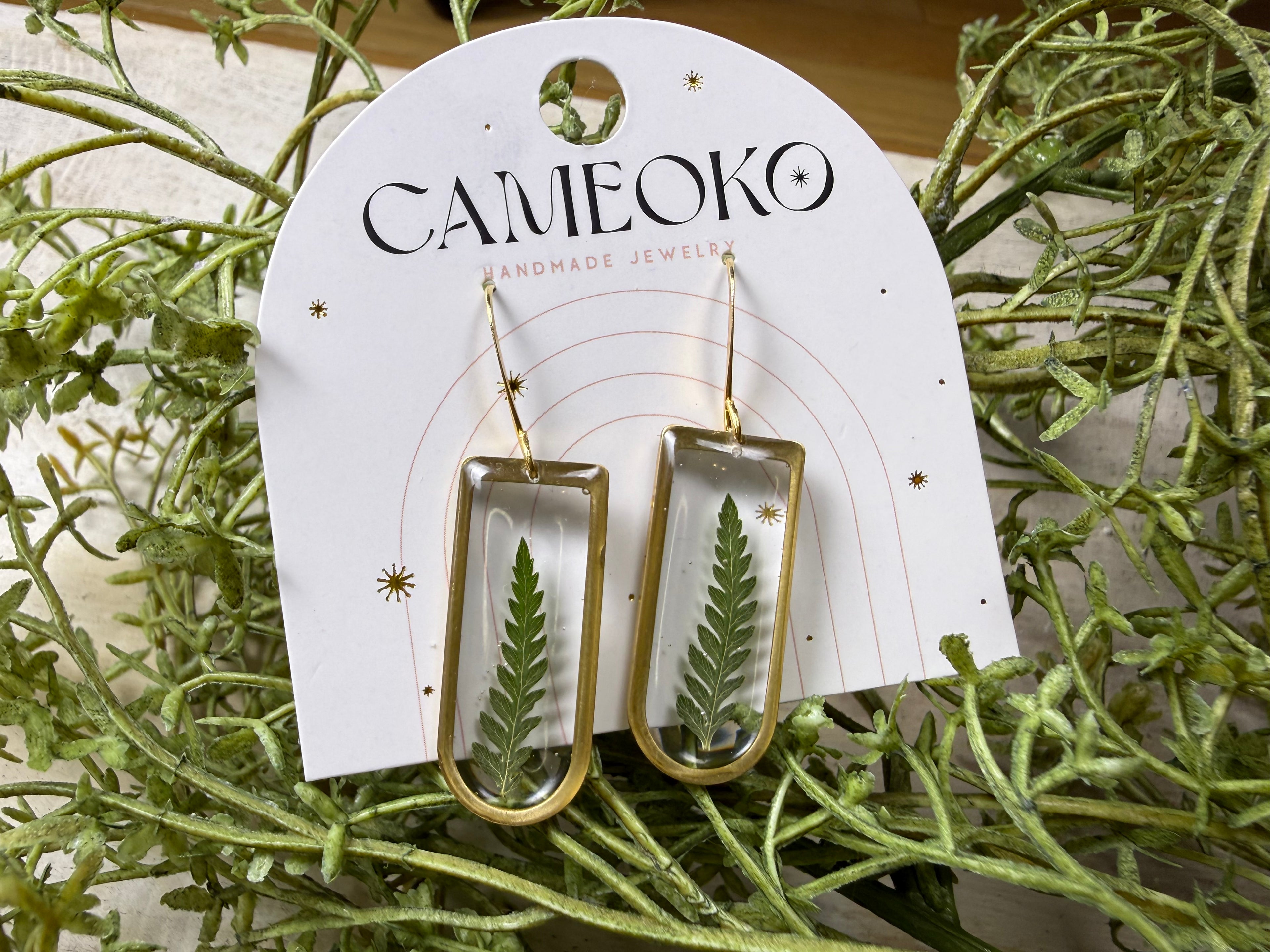 Handmade, hand pressed fern dangly earrings from a real fern made in resin. Gold plated earring hooks. 